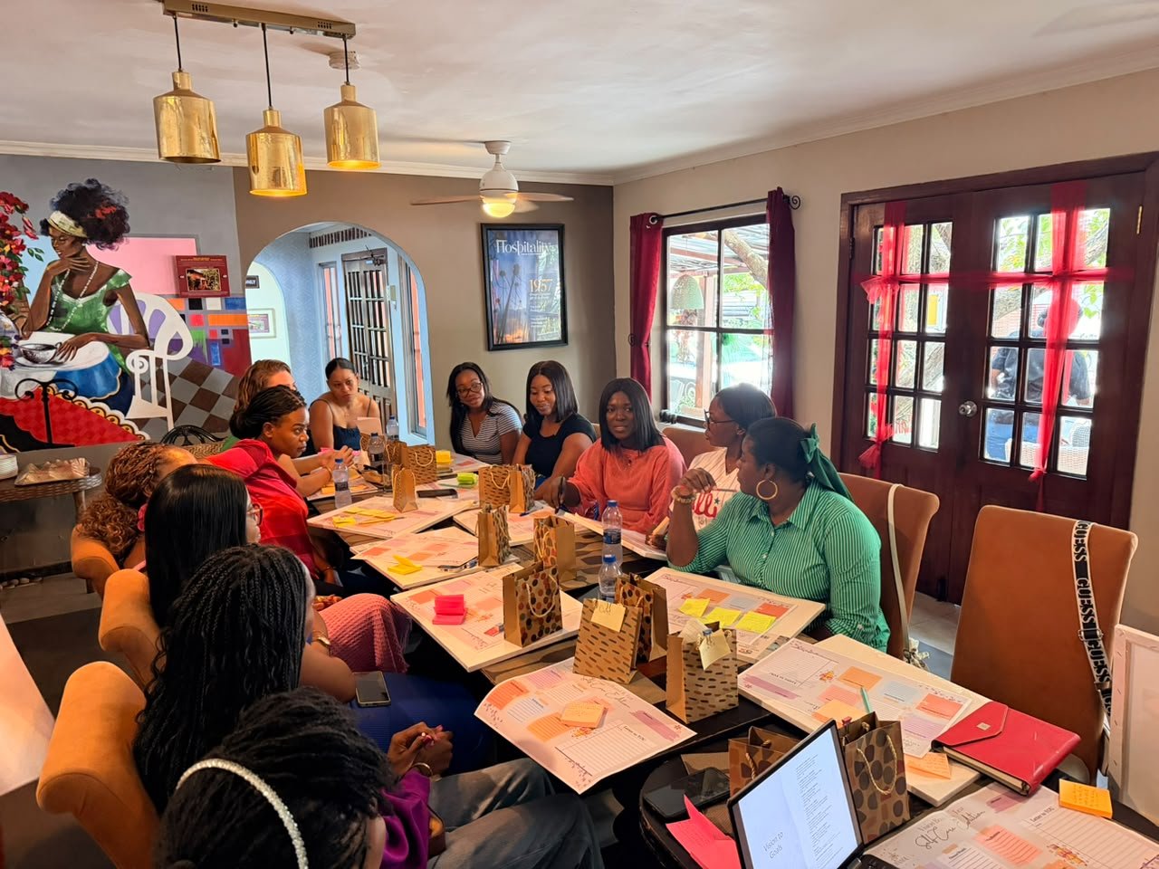 Mums in discussion around a table full of vision boards